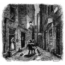 Two men are fighting in a narrow street at night
