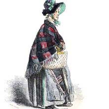 Portrait of an old woman wearing a hat and a shawl and carrying a basket