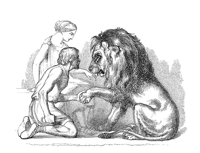A lion licks a young woman's hand while a man takes its paw to clip its claws