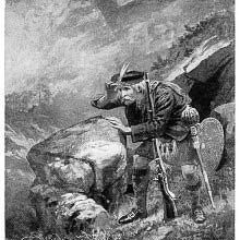 A Scot has stopped on a mountain path to look at something in the distance