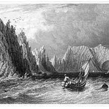 A small sailboat approaches Scratchell's Bay with the Needles Rocks on the left