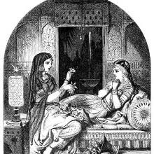 A woman is reclining on a bed as another beside her performs a magic ritual