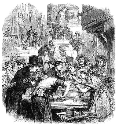 People are gathered around the stall of an oyster seller