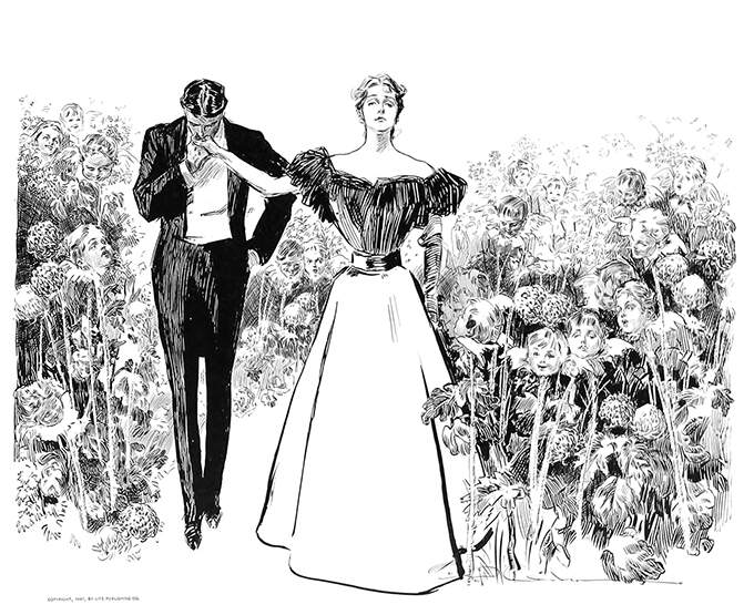 A man kisses a woman's hand in a garden where the flowers are human faces