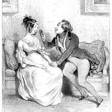 A woman is sits next to a man marvelling at the expensive portrait she gave him