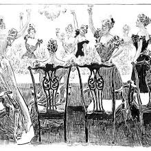 Women have stood up around a dinner table to toast one of them who remains seated