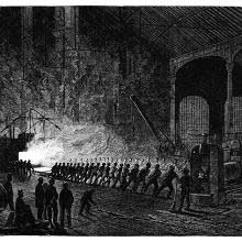 A plate of whit-hot iron is rolled from a furnace by a body of workers