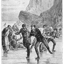 A group of people is ice-skating in a rocky landscape