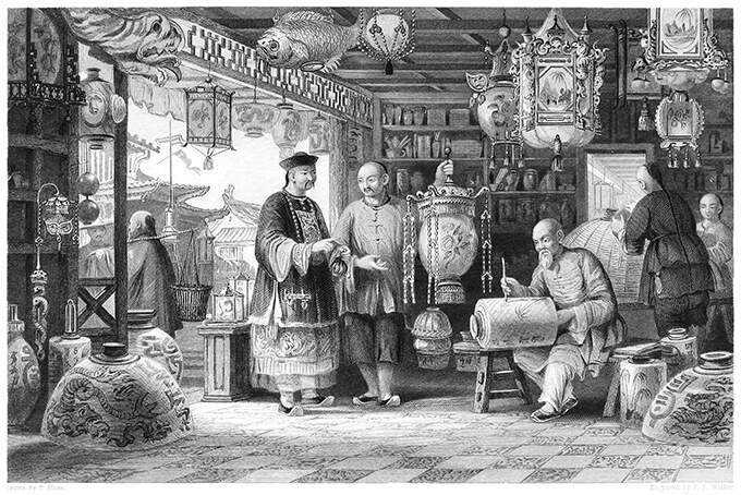 Shop of a Chinese lantern merchant with sellers presenting lanterns to customers