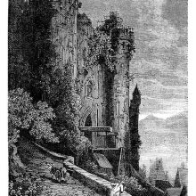 View of the façade of a somewhat run-down castle and a side street going up