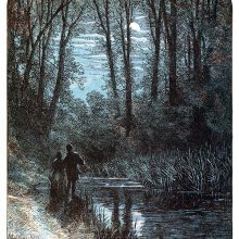 A couple stands on the bank of a stream and looks at the moon through the trees