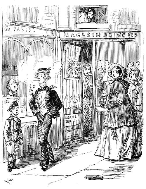 A stylish young man walks the street followed by the gaze of a group of women