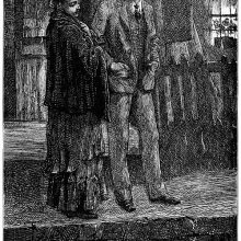 A woman and a man stand by the riverside at night, he looking at her, and she at the water