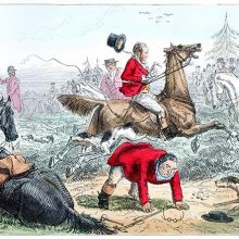 At a fox hunting meet, a man has fallen from his horse and tries to get back to his feet