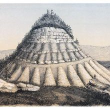 View of a cone-shaped mountain topped with fir trees in the Tucumcari Valley