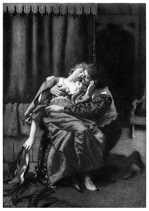 A man is kneeling next to a woman sitting on a chair and embraces her
