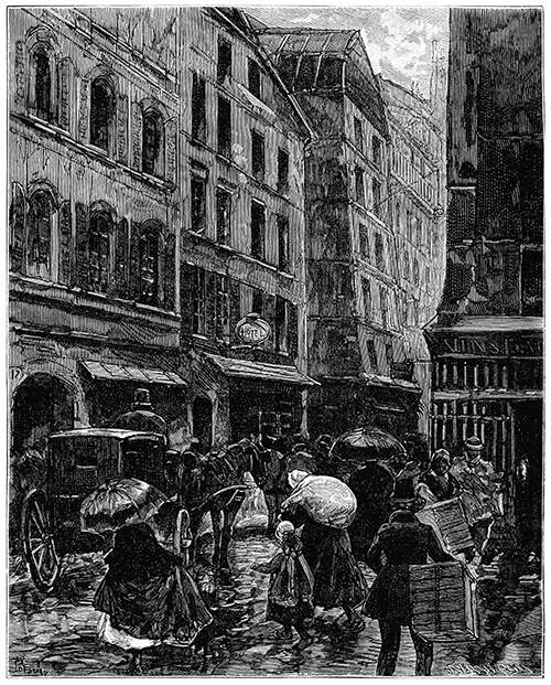 View of a busy street in the rain, with people carrying packages and holding umbrellas