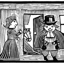 A man stands in a room, fully dressed, with his wife at his side