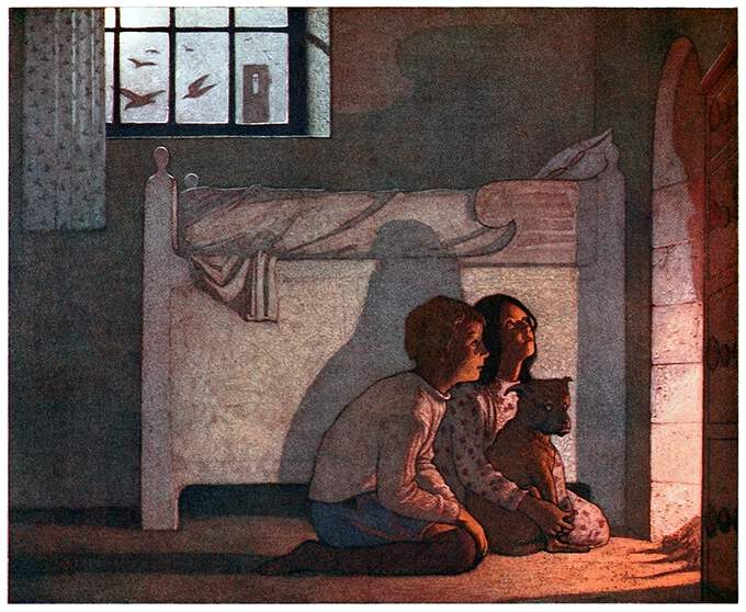 A boy and a girl are kneeling in front of a fireplace as the fire lights up their faces