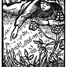 A boy lies in the grass of a riverbank and points his finger at something the viewer can't see