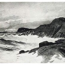View of a rocky shore and cliff beaten by the waves, as seen from sea level