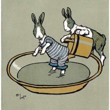 A bunny in a swimming suit stands in a bathtub while another pours water from a watering can