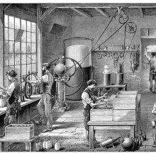 view of a Workshop in a carbonated water factory showing workers filling soda siphons, etc.