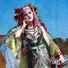 A woman in oriental dress and wreathed in red flowers stands leaning her head on her hand
