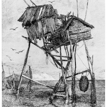 View of two rickety stilt fishing huts rising high above the waters