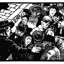 A dense crowd is seen slightly from above being herded by a street policeman