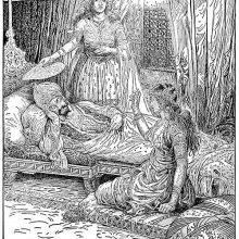 A man is lying on a low couch, listening to a woman sitting on a cushion on the floor