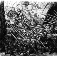 A group of soldiers is breaking through a gate while another group is pushing back from inside