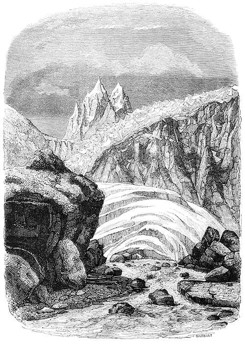 Alpine landscape with rocks, ice sheets, a jagged glacier, and spiky mountain peaks