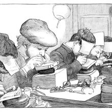 Wood engravers are busy at the workbench, their heads bent over the woodblocks they are carving