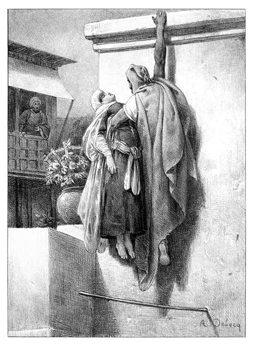 A man hangs from a cornice by the tip of his fingers while holding an unconscious woman