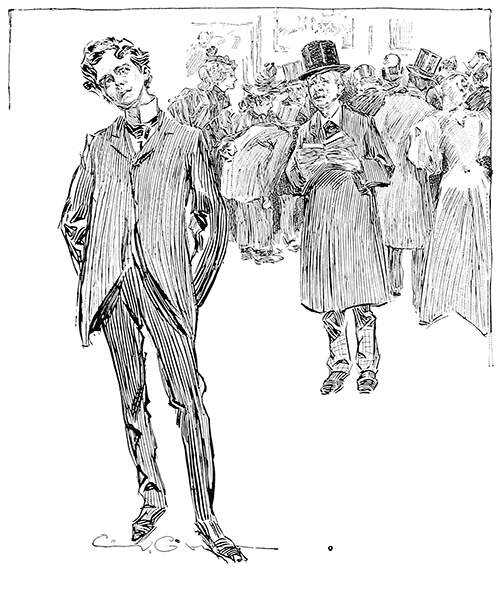 A young man gazes at a painting as most people are pressing around an exhibit on the opposite side