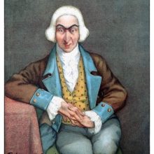 Full face portrait of Baron Munchausen sitting on a chair with one elbow resting on a table