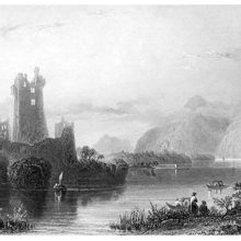 Lough Leane, dotted with a few boats, as the ruins of Ross castle can be seen in the background