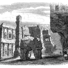 View of the Kailasa temple showing a stone elephant, pillars, and rock-cut architecture