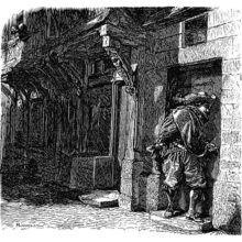 A man stands on a doorstep at night, leaning toward the door as though whispering