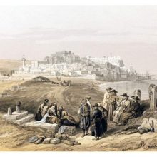 General view of Jaffa with the Mediterranean on the right and people resting in the foreground