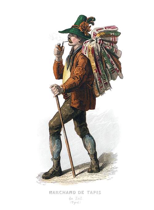 A pedlar wearing a hat and smoking a pipe is seen walking with a load of carpets on his back