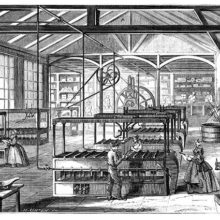 Workshop at the Cusinberche factory, where workers are busy around candle molding machines
