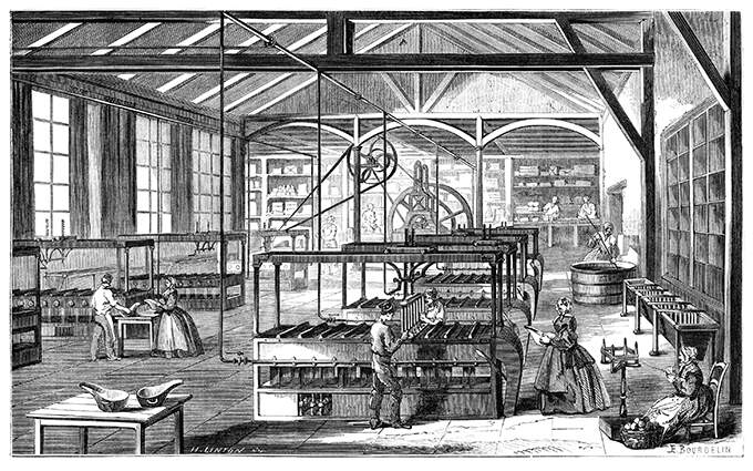 Workshop at the Cusinberche factory, where workers are busy around candle molding machines