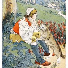 A melancholy man is sitting on the grassy side of a road as his cat paws him tentatively