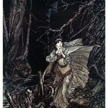 A woman with her cape and dress floating around her stands in a dark forest looking scared