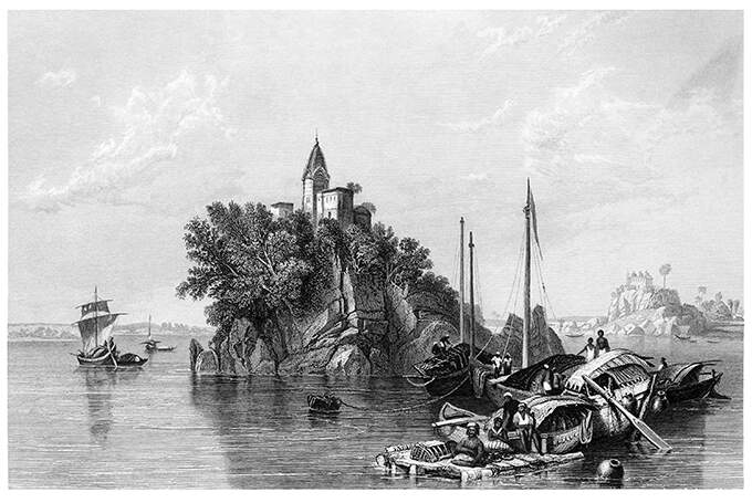 View of a rocky island on the Ganges, topped by a tower, with boats in the foreground