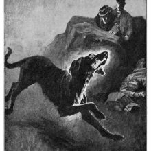 A crazed-looking dog comes racing forth as two men watch in the background, hidden behind a rock