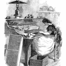 A woman worker at the Imperial Tobacco Factory, Paris, puts wrapper leaves around cigars