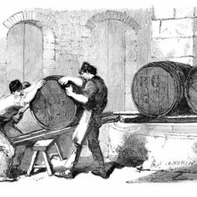 Three workers at a soap factory are moving an oil barrel up an inclined plane made of two planks
